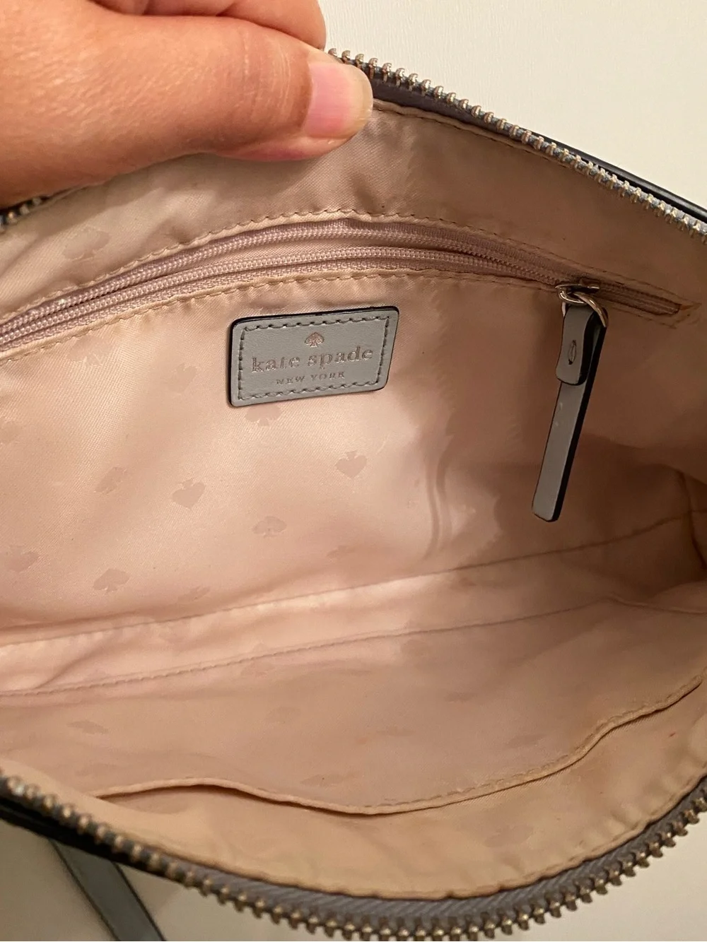 Kate Spade light gray leather crossbody bag with gold spade logo